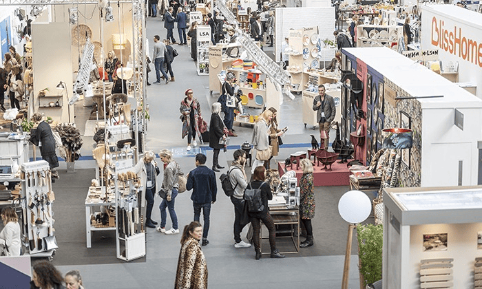 Elegant luxury car fragrances displayed at Rosy Roo trade show stall.