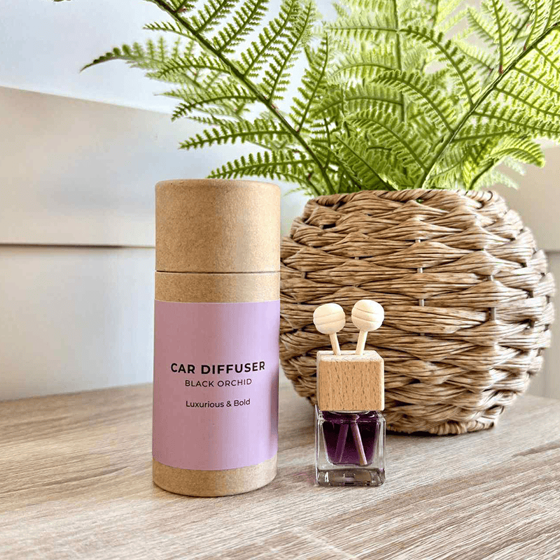 Car diffuser with Black Orchid scent in eco-friendly packaging and luxury fragrance oils.